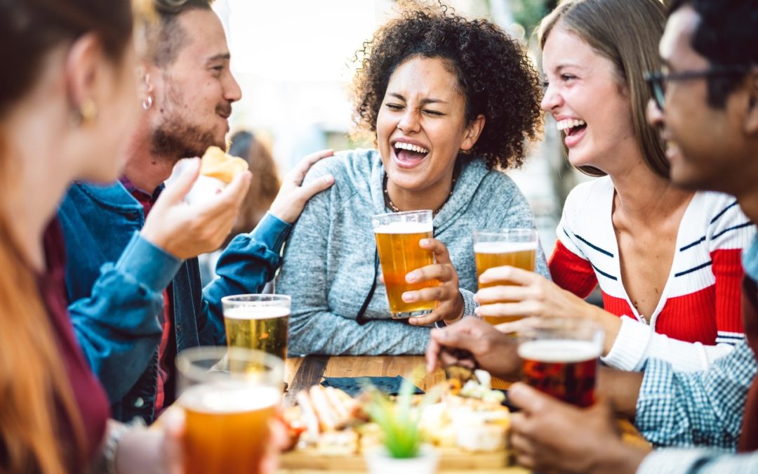 group-of-friends-laughing-over-beers