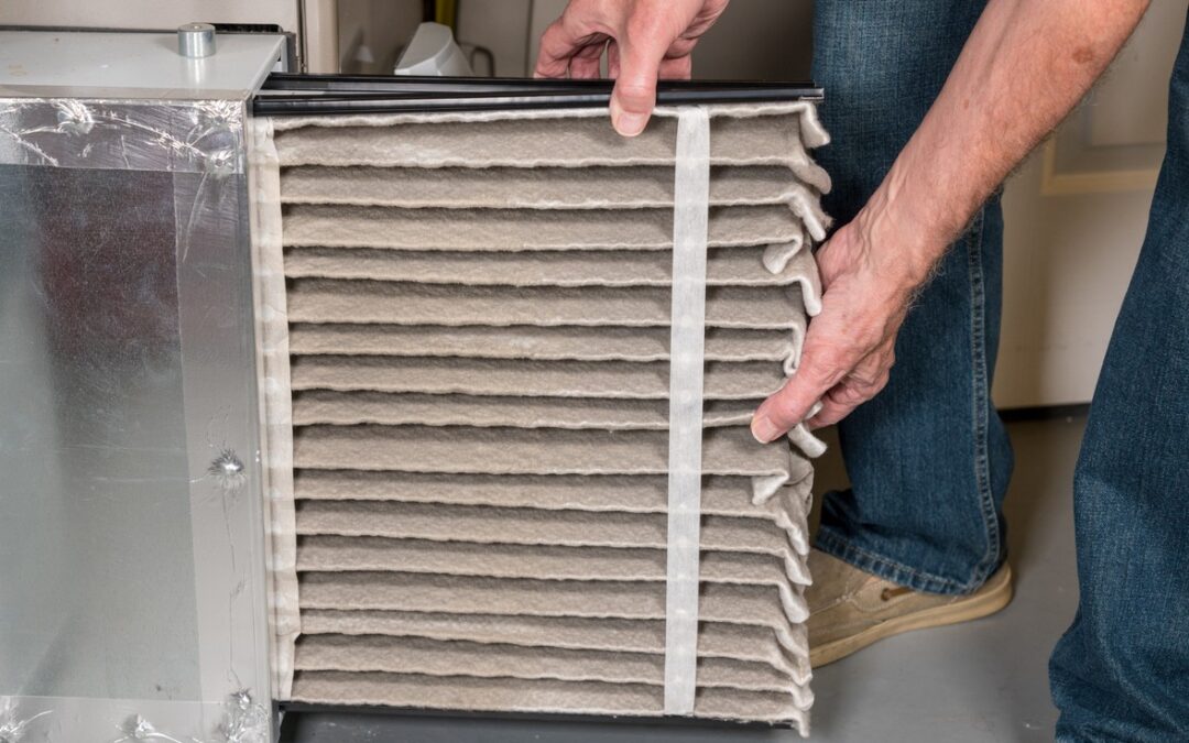 Changing a dirty furnace filter is important to winterize your rental home in Bend, Oregon.