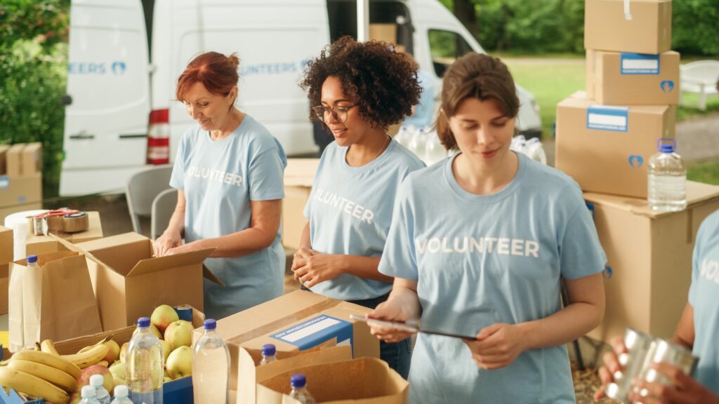 Three women volunteering at a food bank in Bend, Oregon.